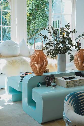 interior design coffee table with basket beside sofa indoors